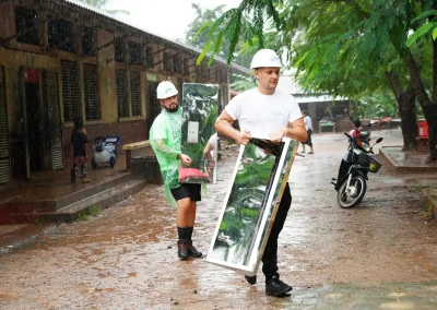 Ben and Connor carrying materials