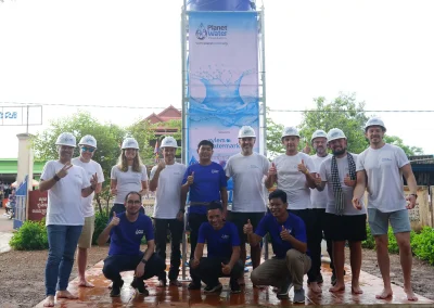 Volunteers in front of the water tower