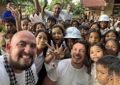 Volunteers with school children